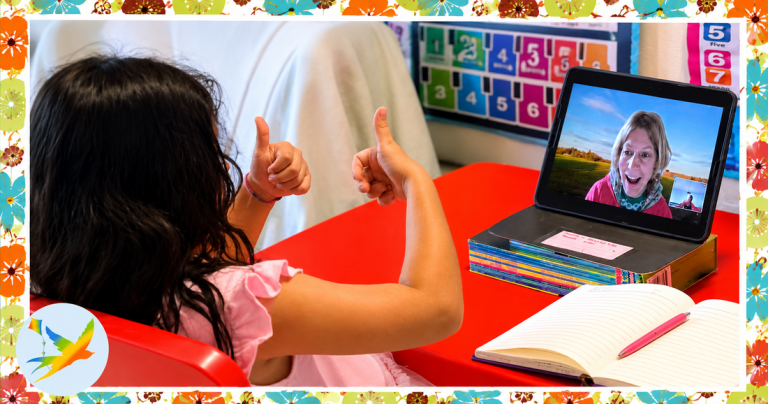 Young learner enjoying a live online lesson with a private tutor, using a tablet, notebook and educational resources in a supportive home learning environment.